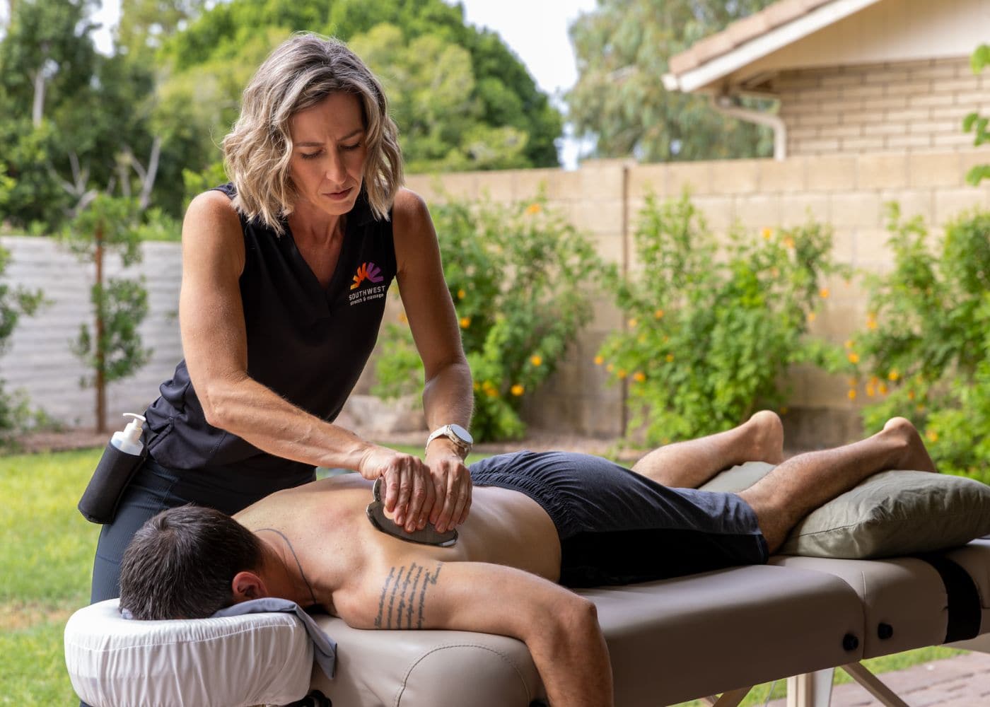 Therapist performing cupping therapy during an in-home session
